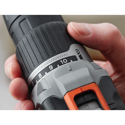 Close-up of BLACKDECKER BCK21S1S cordless drill, focus on adjustable torque settings and ergonomic grip.