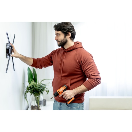 BLACK+DECKER screwdriver lifestyle with hand/person included