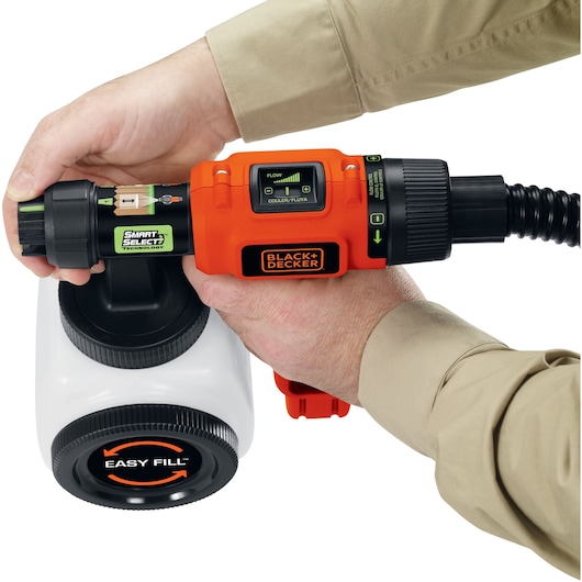 Photo of BLACK+DECKER BDPH200B handheld paint sprayer with orange body, adjustable settings, and white easy fill container.