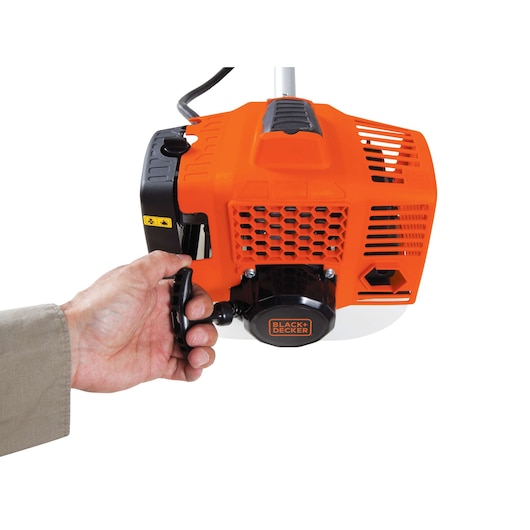 Photo of BLACK+DECKER GST43 orange engine with pull start, close-up on white background.